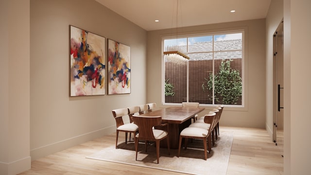 dining area with light hardwood / wood-style floors