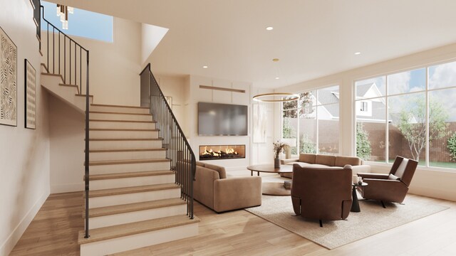 interior space with light hardwood / wood-style floors and a multi sided fireplace