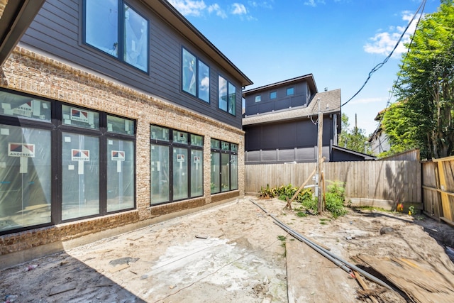 1615 Milford St, Houston, TX 77006 - rear view of property featuring brick siding