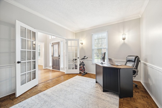 office space featuring dark parquet flooring, ornamental molding, french doors, and a textured ceiling