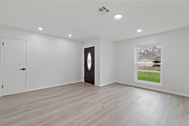 entryway with light hardwood / wood-style floors