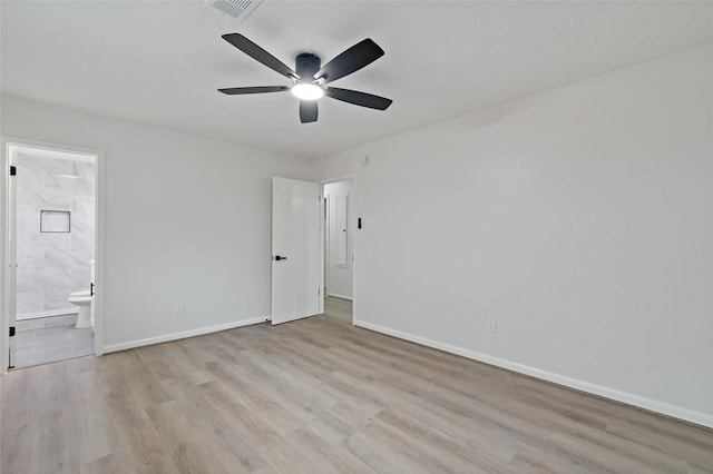 unfurnished bedroom with connected bathroom, light hardwood / wood-style floors, and ceiling fan