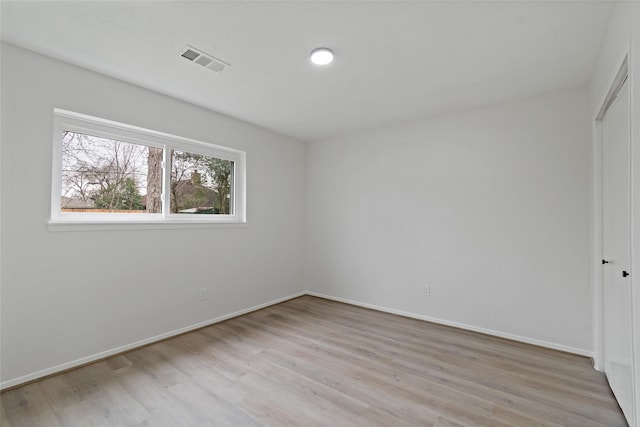 unfurnished room featuring light wood-type flooring