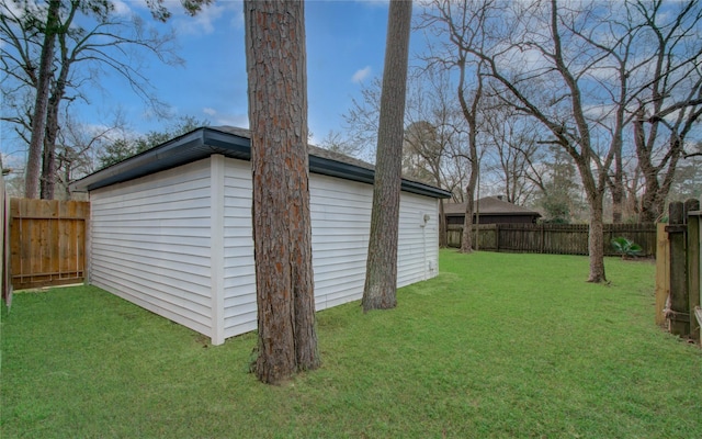 view of outdoor structure featuring a lawn