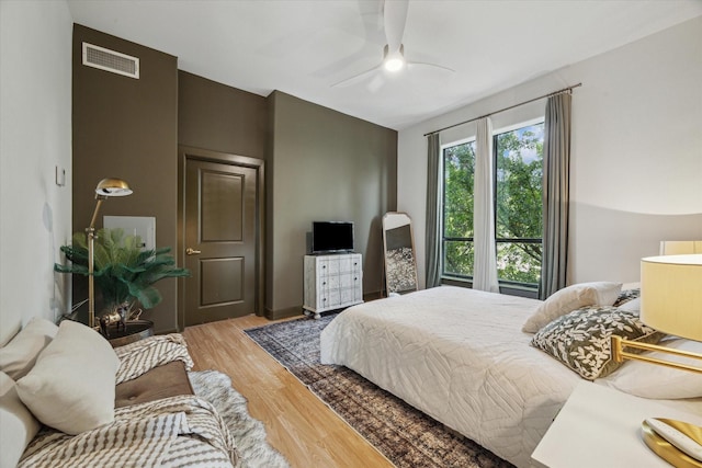 bedroom featuring ceiling fan and light wood-type flooring