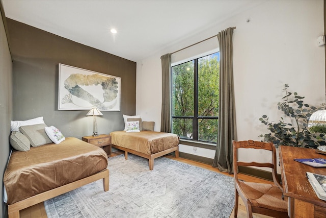 living area featuring hardwood / wood-style flooring and a healthy amount of sunlight