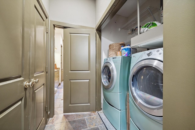 washroom featuring independent washer and dryer