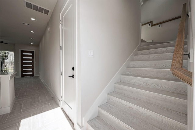 stairway with parquet flooring