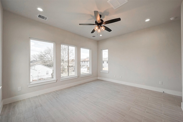 empty room with light hardwood / wood-style flooring and ceiling fan