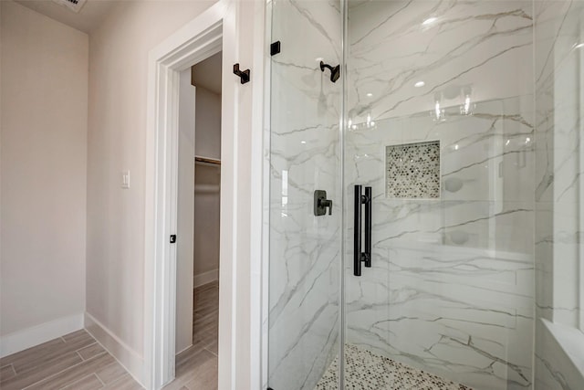 bathroom featuring an enclosed shower