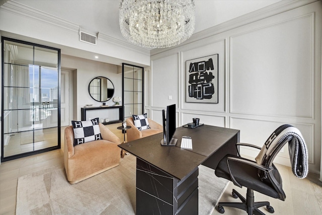 office space with crown molding and an inviting chandelier