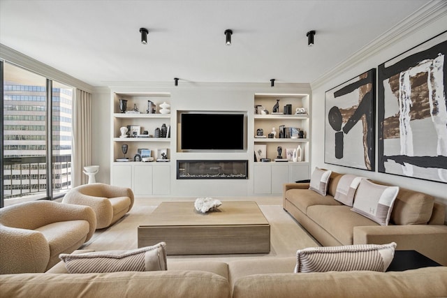 living room featuring built in shelves and ornamental molding