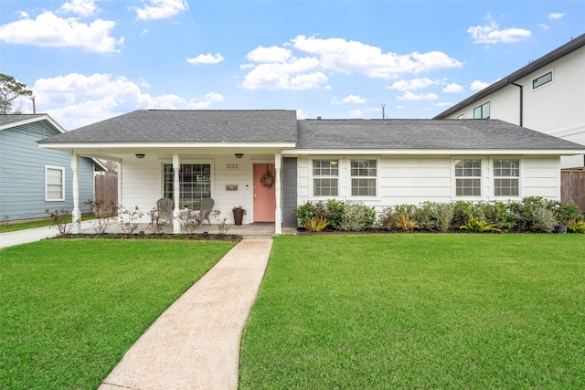 single story home featuring a front yard and covered porch