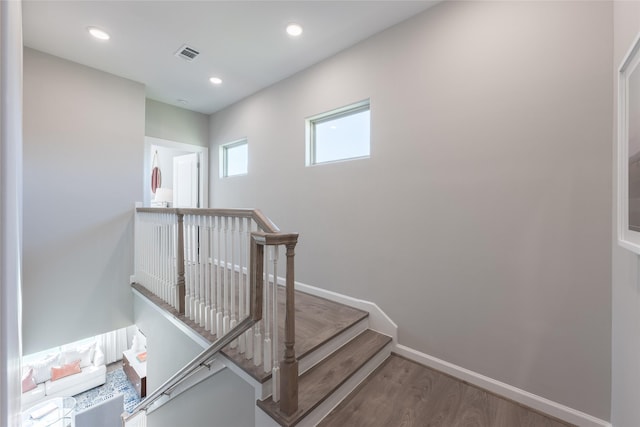 staircase featuring hardwood / wood-style floors