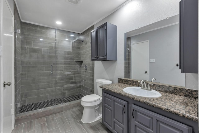 bathroom with vanity, an enclosed shower, and toilet