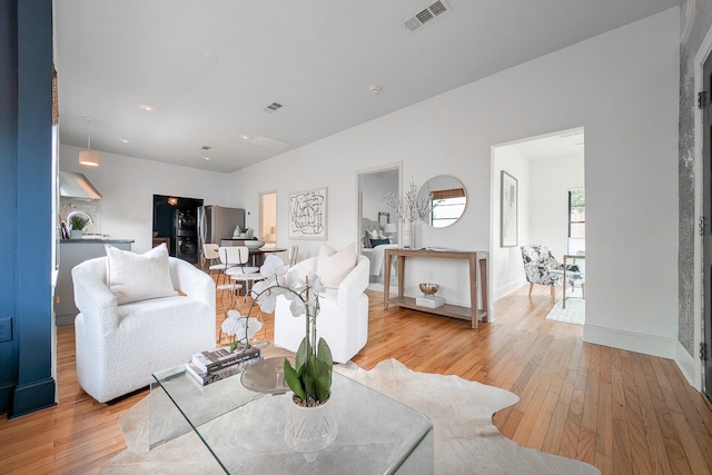 living room with light hardwood / wood-style flooring