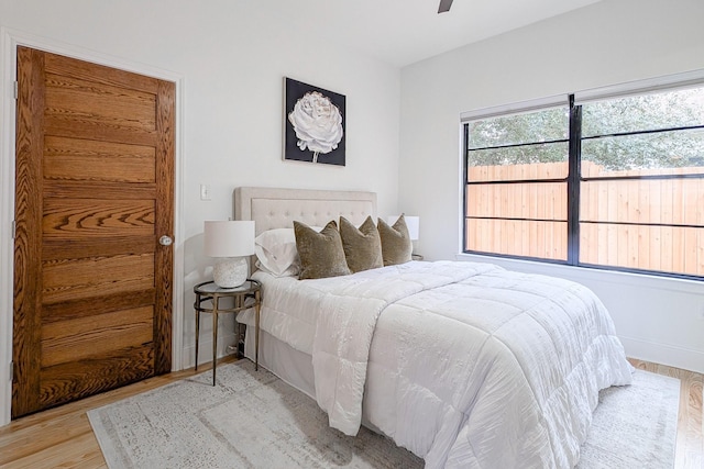 bedroom featuring ceiling fan and light hardwood / wood-style floors