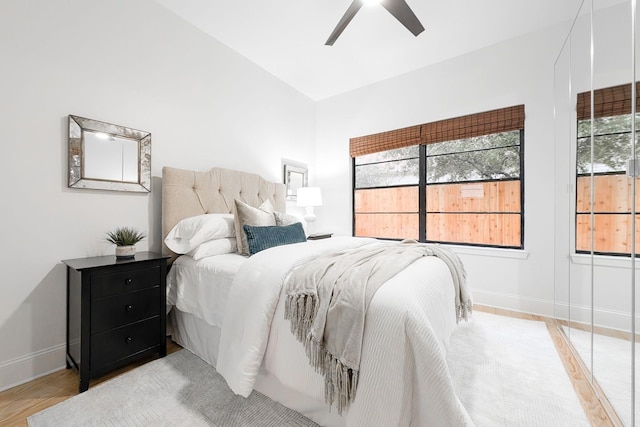 bedroom with ceiling fan and light wood-type flooring