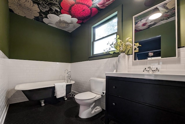 bathroom with tile walls, a bath, tile patterned floors, and toilet