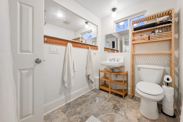 bathroom with sink and toilet