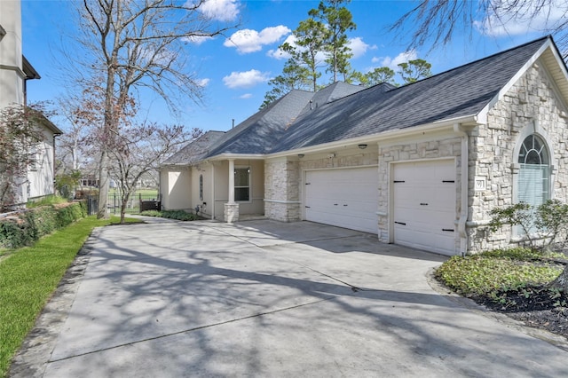 view of side of property with a garage