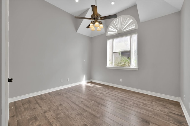 unfurnished room with ceiling fan, lofted ceiling, and light wood-type flooring