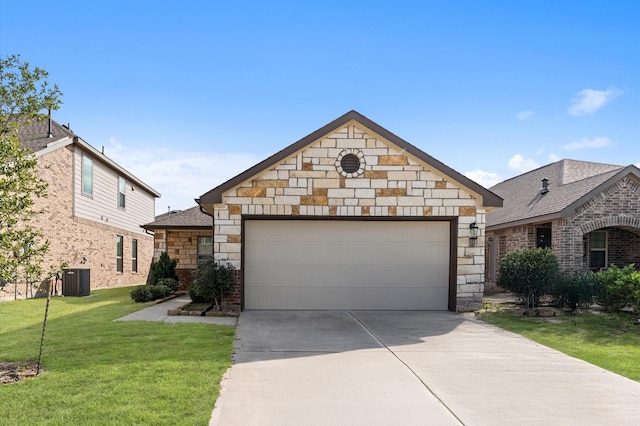 view of front of property with a garage, an outbuilding, central AC, and a front yard