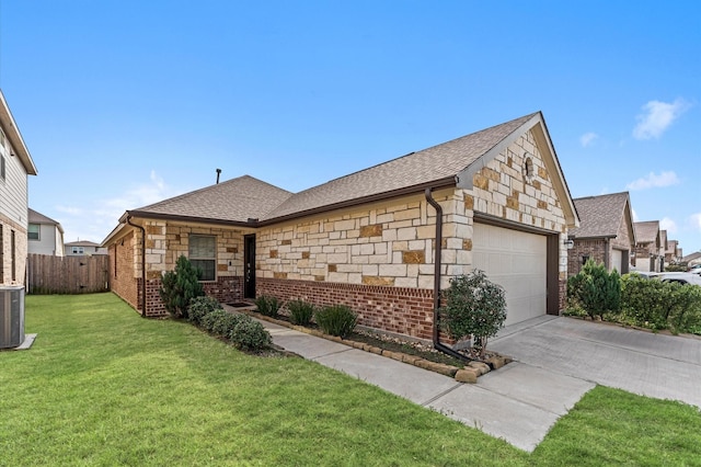 single story home with a front lawn and a garage