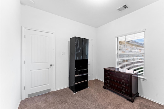 bedroom with light carpet