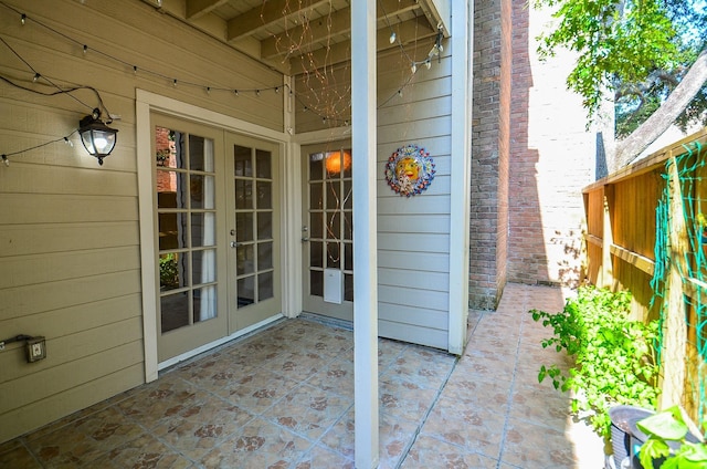 entrance to property with a patio and french doors