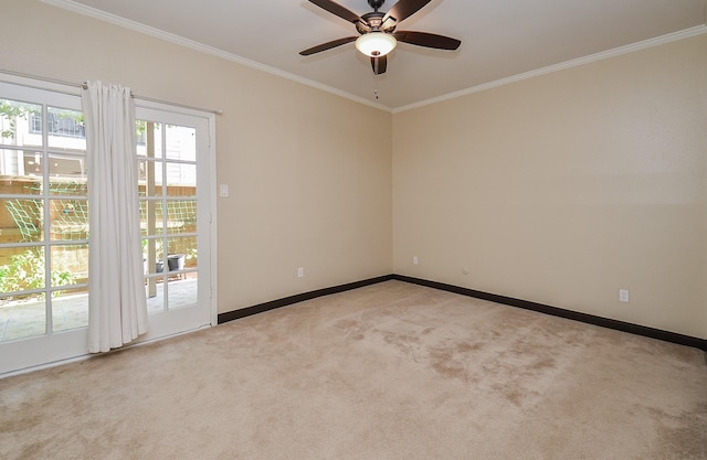 carpeted empty room with crown molding and ceiling fan