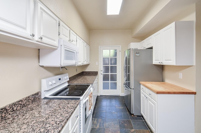 kitchen with white appliances, butcher block countertops, and white cabinets