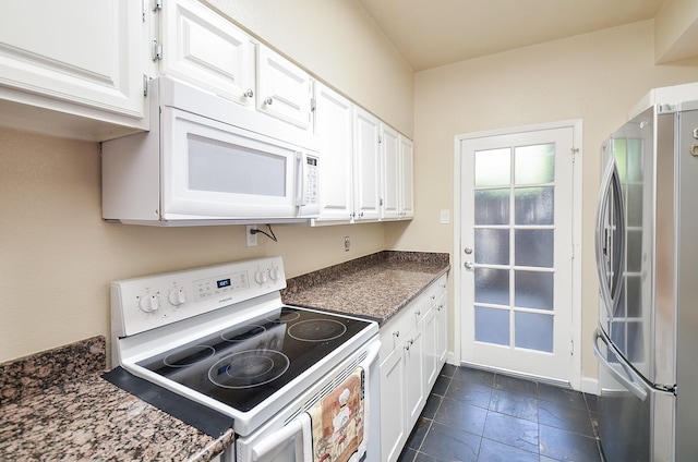 kitchen with white cabinetry and white appliances