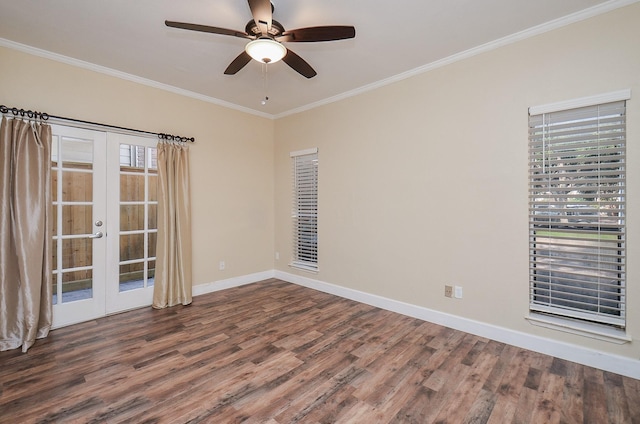 empty room with french doors, crown molding, and hardwood / wood-style flooring