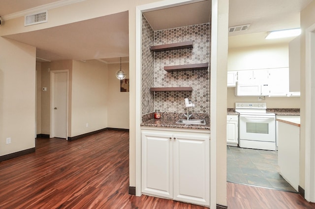 kitchen with white cabinetry, sink, dark hardwood / wood-style flooring, and white range with electric cooktop