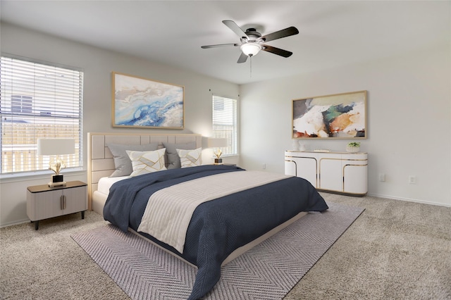 bedroom with a ceiling fan, baseboards, and light carpet