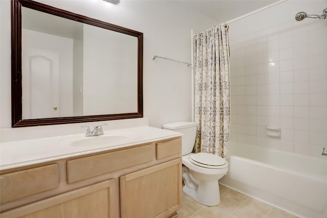 full bath featuring vanity, shower / tub combo, toilet, and tile patterned flooring