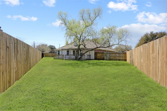 view of yard with a fenced backyard