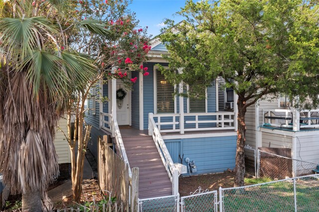 1621 Ursuline St, Galveston, TX 77550 - view of front of property featuring covered porch, fence private yard, a gate, and stairs