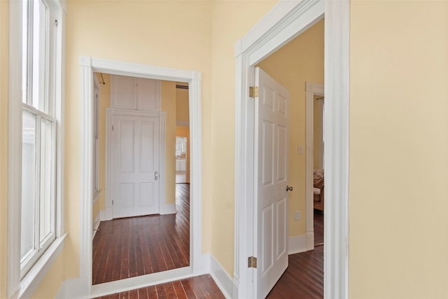 1621 Ursuline St, Galveston, TX 77550 - hall featuring dark wood-type flooring and baseboards