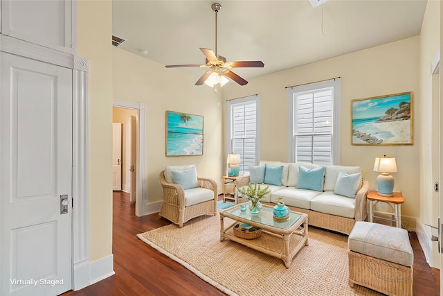 1621 Ursuline St, Galveston, TX 77550 - living room featuring dark wood-style floors, a ceiling fan, and baseboards