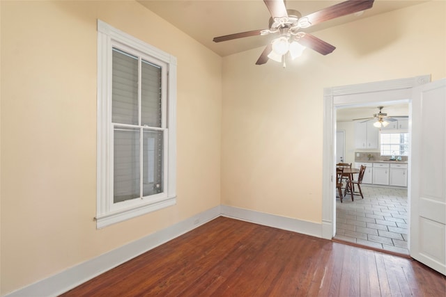 1621 Ursuline St, Galveston, TX 77550 - unfurnished room with baseboards, ceiling fan, and dark wood finished floors