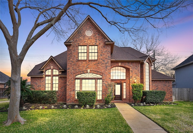 front facade with a yard