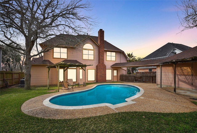 pool at dusk with a gazebo, a yard, central AC, and a patio area