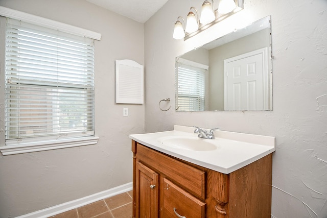 bathroom with tile patterned flooring and vanity