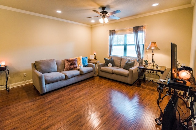 living room featuring dark wood-type flooring, ornamental molding, and ceiling fan