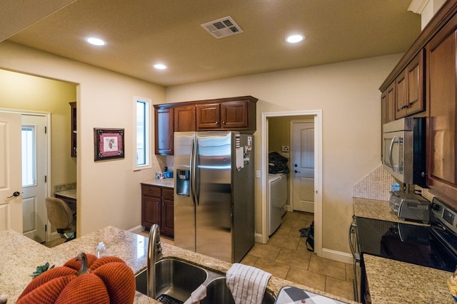 kitchen featuring stainless steel appliances and sink