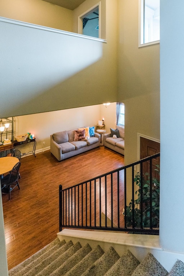 stairs featuring hardwood / wood-style flooring