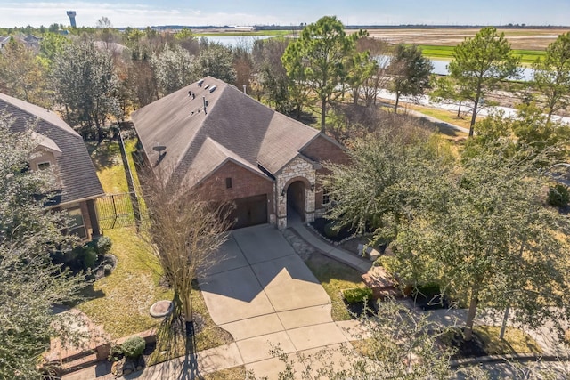 birds eye view of property with a water view