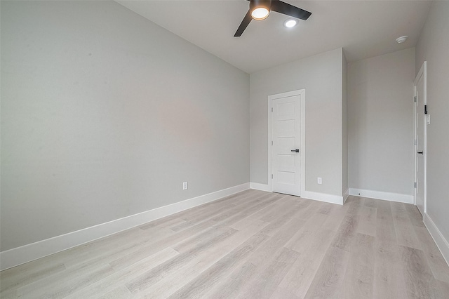 spare room with ceiling fan and light hardwood / wood-style floors